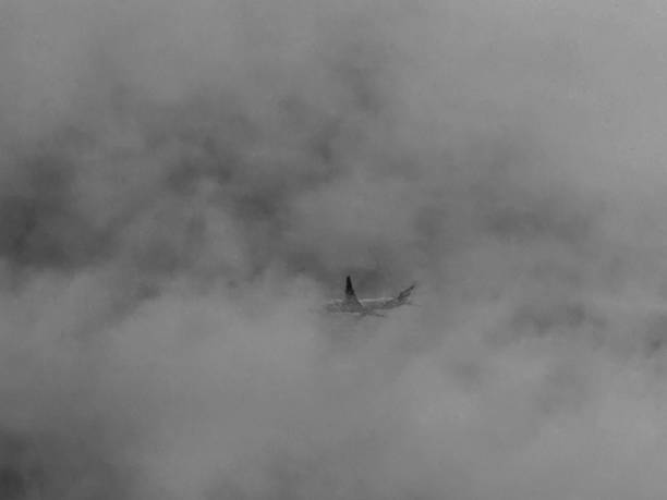 istock A commercial aircraft flying through low cloud 2161229427
