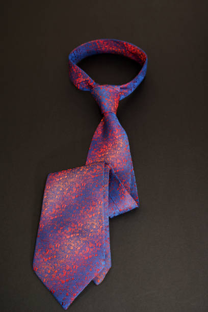 istock Multi coloured fashion necktie isolated on black background close-up view single object 2161229595