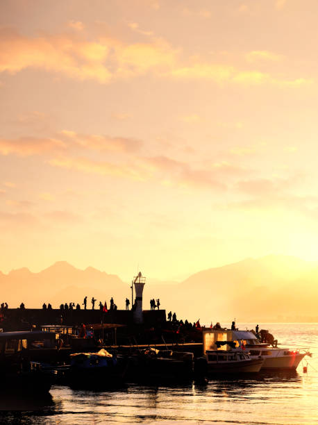 Group of silhouetted people at marina in Antalya, Mediterranean Turkey