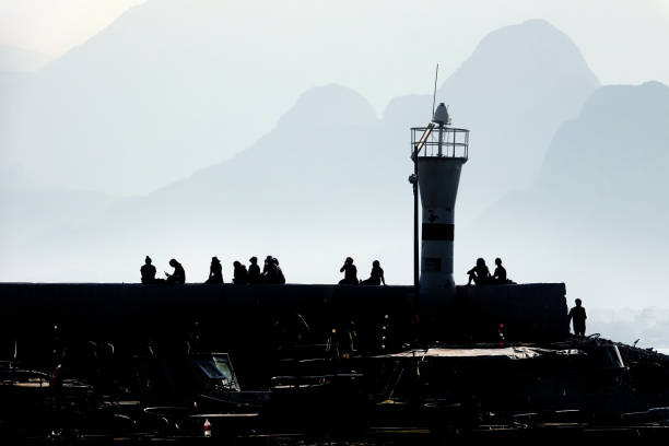 Group of silhouetted people at marina in Antalya, Mediterranean Turkey