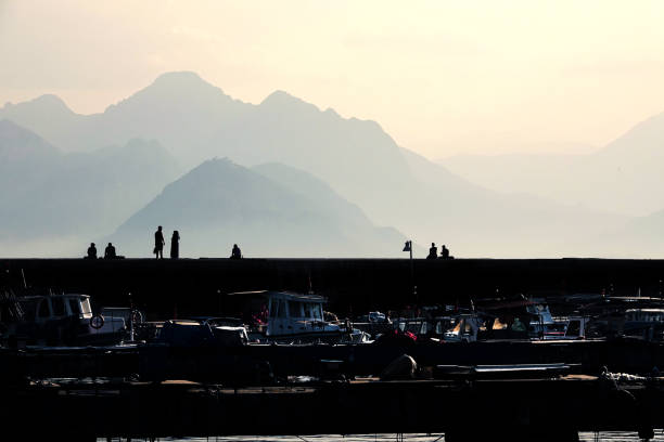 Group of silhouetted people at marina in Antalya, Mediterranean Turkey