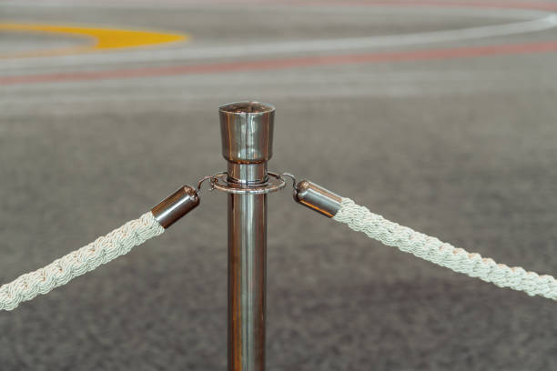 istock Rope fencing with silver posts for an expensive event. 2161231265