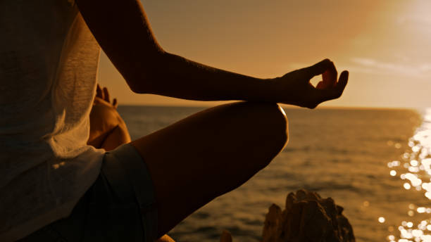 istock Caucasian Woman Practicing Seaside Meditation 2161231442