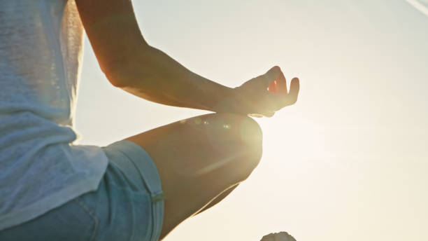 istock Caucasian Woman Practices Seaside Yoga 2161231459
