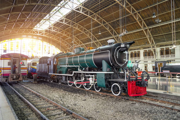 istock Retro steam train arrived from the arch railway station. 2161234227