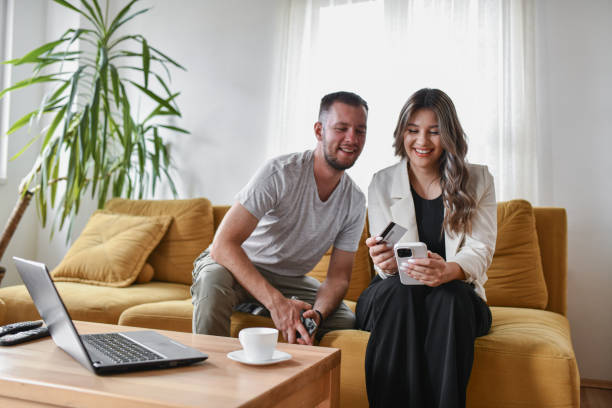 istock Online Stores Explored Via Smartphone By Cute Couple 2161235289
