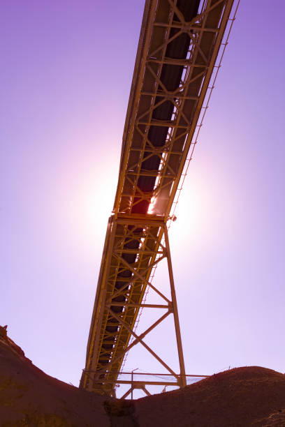 View from below of a conveyor belt at a processing plant in an open-pit copper mine in Chile.
