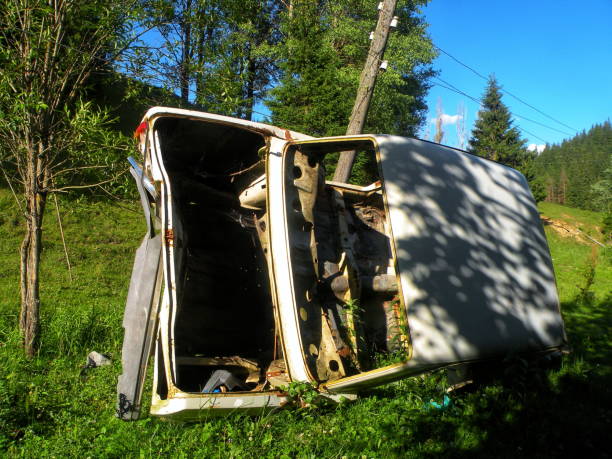 istock Abandoned Overturned Car in the Woods 2161235545