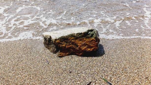istock sea ​​water, seashore, stone fragment 2161237649