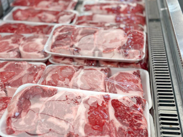 istock Raw steaks in market display 2161240376