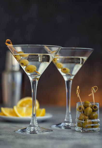 istock Two glasses of martini with olives 2161244667