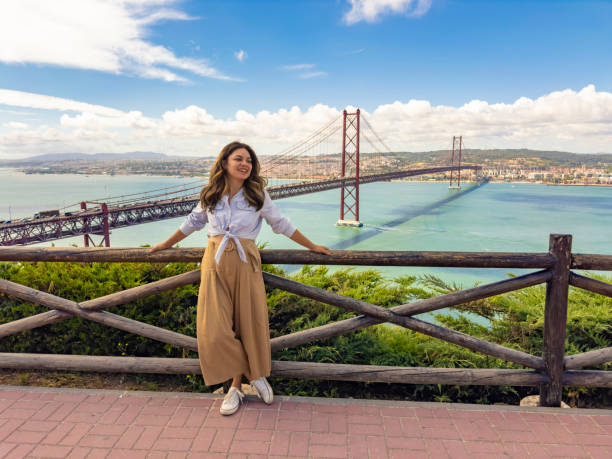 istock Tourist woman at viewpoint overlooking bridge 2161246211