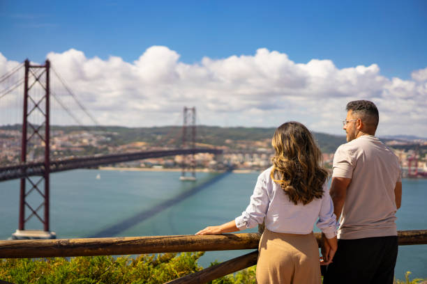 istock Tourists looking at Lisbon bridge 2161246410