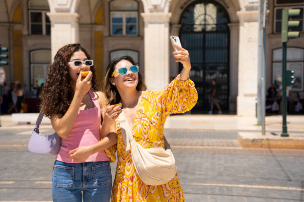 istock Tourists taking a selfie eating 2161249265