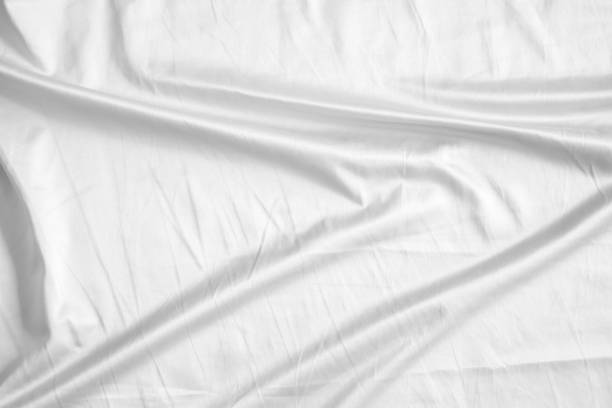 istock Abstract white wrinkled bedding sheet fabric texture background 2161251642