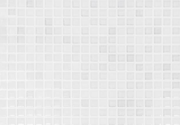 istock White tile wall chequered background bathroom texture. Ceramic brick wall and floor tiles mosaic background in bathroom and kitchen clean. Design pattern geometric with grid wallpaper decoration. 2161251790