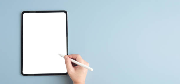 istock Woman hand using digital tablet with blank screen for mock up and copy space on grey background, template, people technology and lifestyle 2161252779