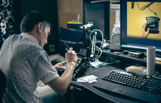 istock A young man repairs the engine steering wheel on a joystick. 2161257428