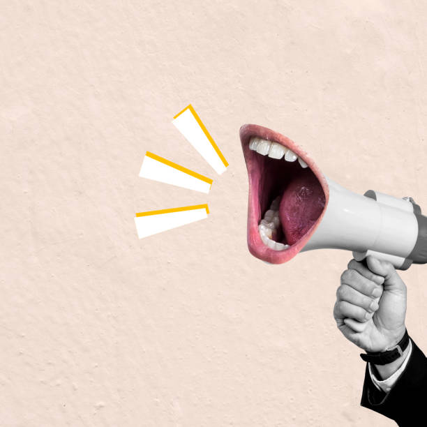 istock A man is holding a microphone and making a loud noise 2161258478