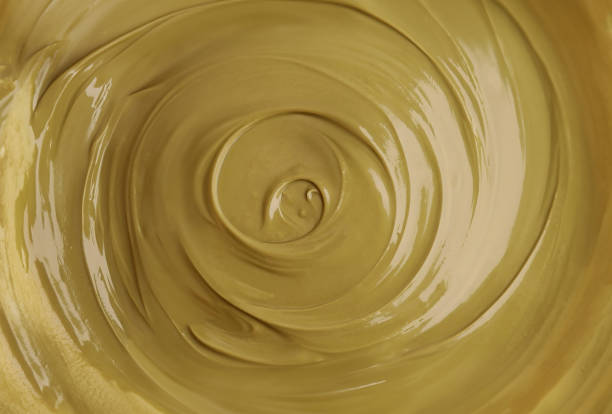 pistachio paste, Pistachio cream. green background.