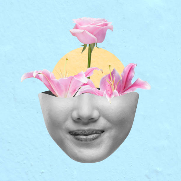 istock A woman's face is covered with flowers, including a rose and a lily 2161258694