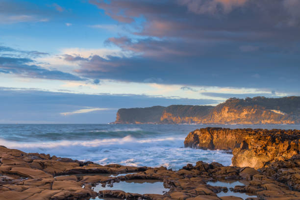 istock Sunrise, sea, waves, clouds and tessellated rock platform 2161258805