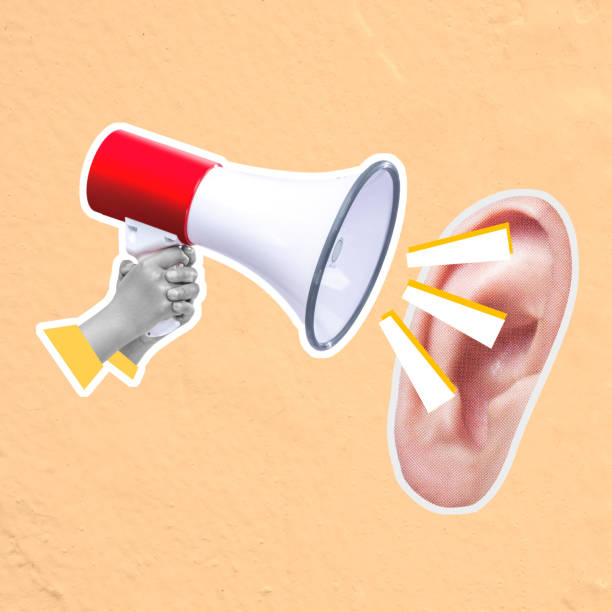 istock Person holding megaphone screaming at ear promoting communication 2161259229