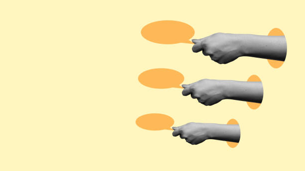 istock Three hands are holding up orange circles, with one hand pointing to the left 2161259308