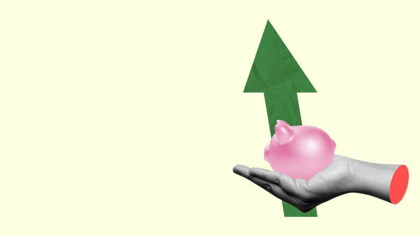 istock A human hand holding a piggy bank with an increased graph arrow 2161259668