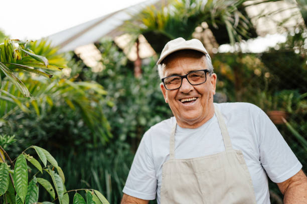 istock Smiling senior man in his plant store 2161260844