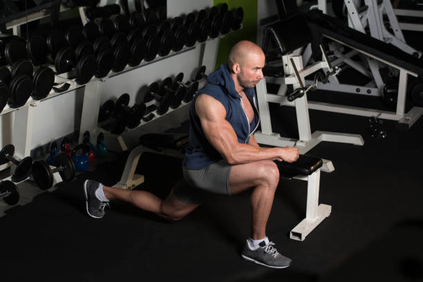 istock Bodybuilder Man Stretches At The Floor 2161260892