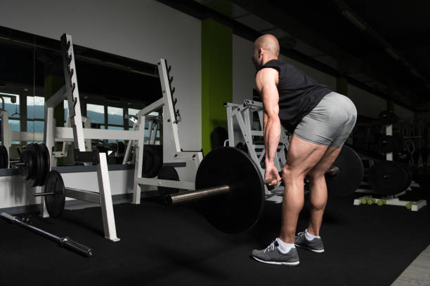 istock Back Exercise With Barbell In Fitness Center 2161260908
