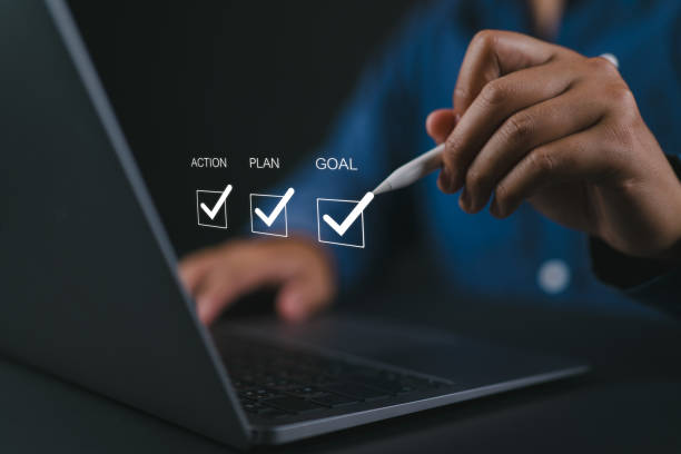 istock Goal, plan and action concept. Business strategy and business development. Businessman using laptop to checking mark on checkboxes on virtual screen. 2161262622