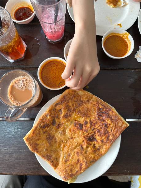 istock Roti Parata or Roti canai with curry sauce popular Malaysian breakfast 2161263010