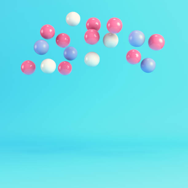 istock Flying spheres on bright blue background in pastel colors 2161267422