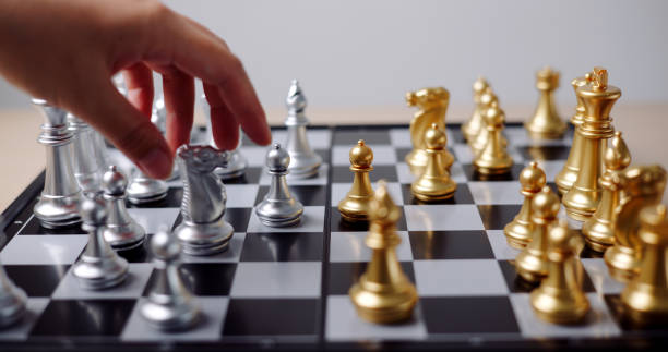 istock Hand moving the pieces of a chess board. 2161270502