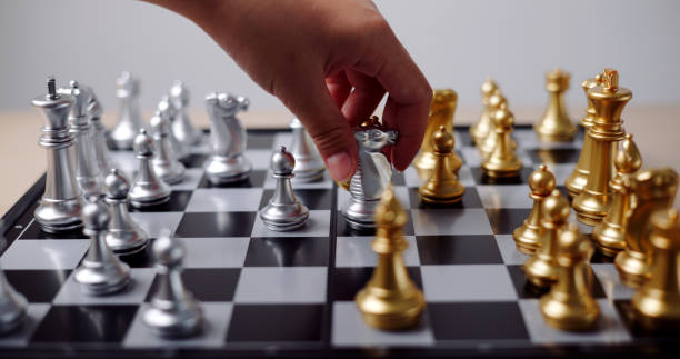 istock Hand moving the pieces of a chess board. 2161270515