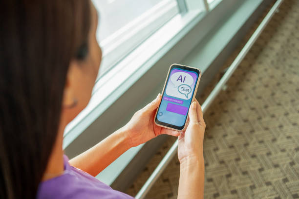 istock woman chatting with AI chatbot using smartphone 2161272759