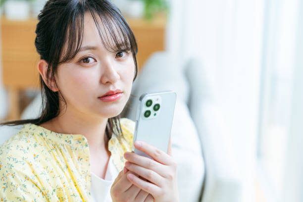istock young woman calling on smartphone 2161277524