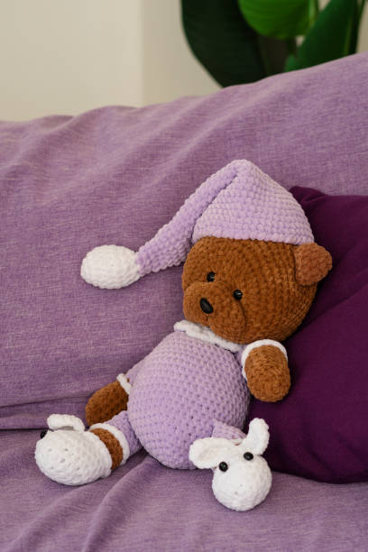 istock Crochet teddy bear in a knitted outfit 2161279157