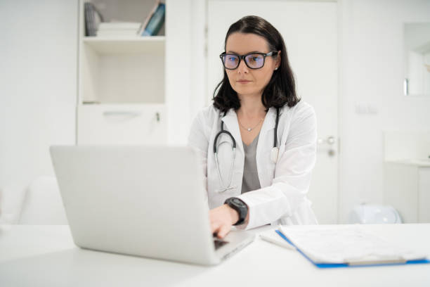 istock Doctor working on a computer at the office 2161279845