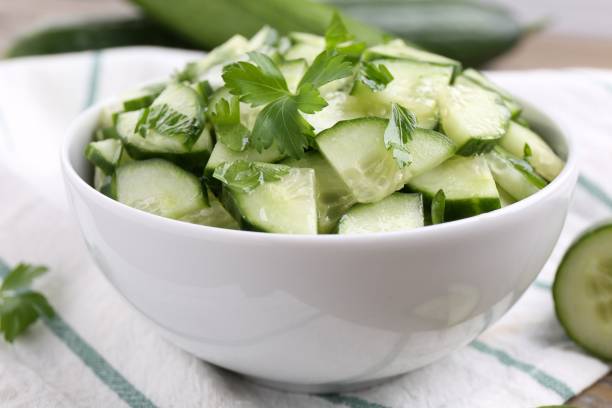 istock Delicious cucumber salad in bowl on table, closeup 2161280265