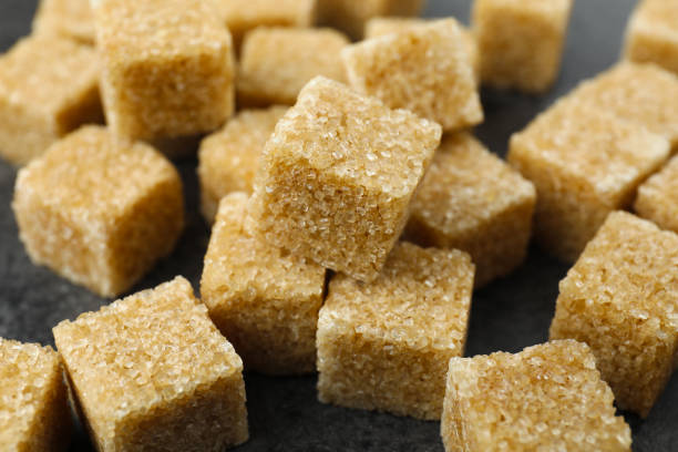 istock Brown sugar cubes on table, closeup view 2161280286