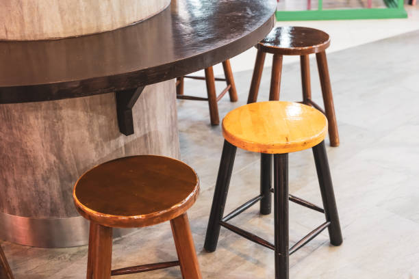 istock Low Wooden Chairs Around Wooden Bar Table Support. 2161281587