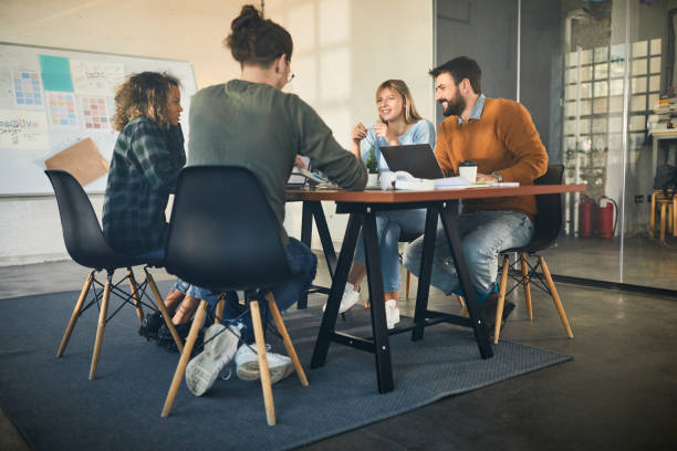istock Happy creative team having a meeting at casual office. 2161283650