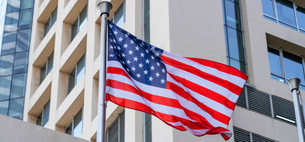istock American flag and Modern buildings in the metropolis wide panoramic 2161284933