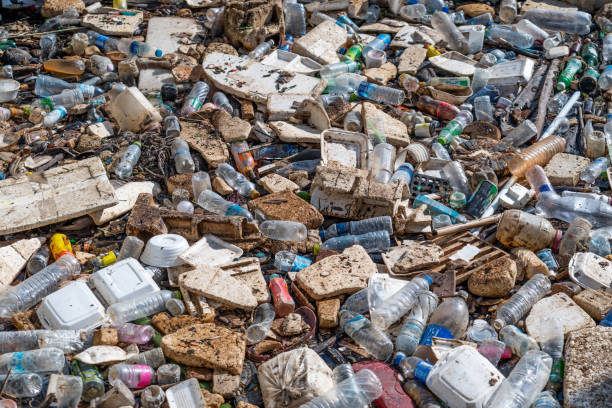 istock Large blockage pile of garbage stretches parallel to the river - plastic, rubber, and others. Waste petroleum products are the main ones. 2161285141