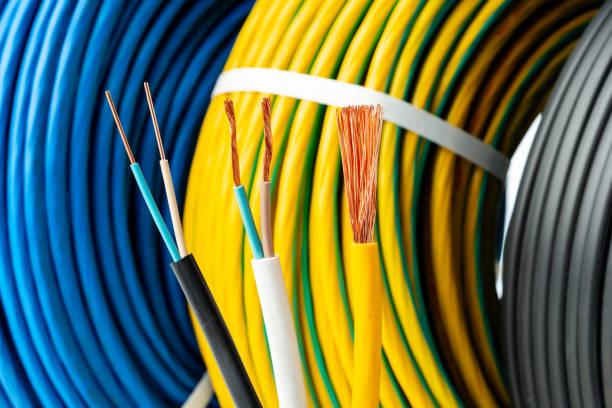 istock Closeup of Stripped Electrical Wires Against Rolled Cable 2161285357