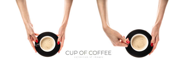 Female hands hold a white ceramic cup on white background. Female hands with fresh red manicure. Isolated on white background. High quality photo