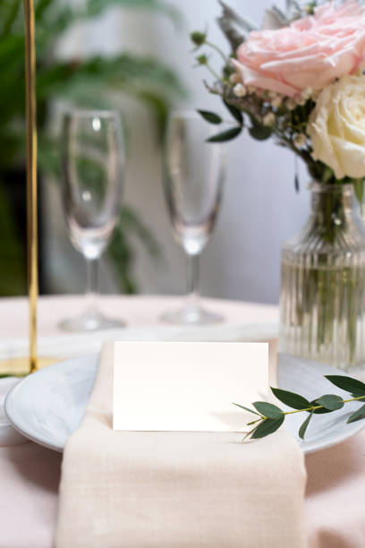 istock Mockup white blank space card, for Name place, Folded, greeting, invitation on wedding table setting background. 2161290874